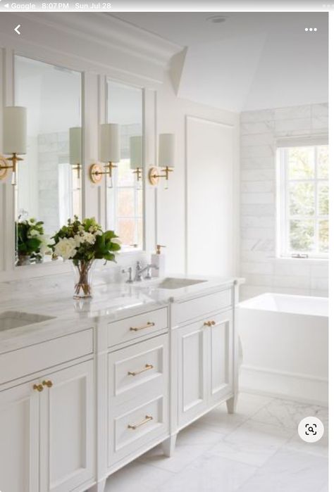 Primary Bath Cabinets, Bathroom Vanity Mirror With Sconces, White Master Bath Vanity, Cream Master Bath Ideas, Low Country Bathroom, Grandmillenial Master Bath, Coastal Traditional Bathroom, Elegant Primary Bathroom, Coastal Glam Bathroom