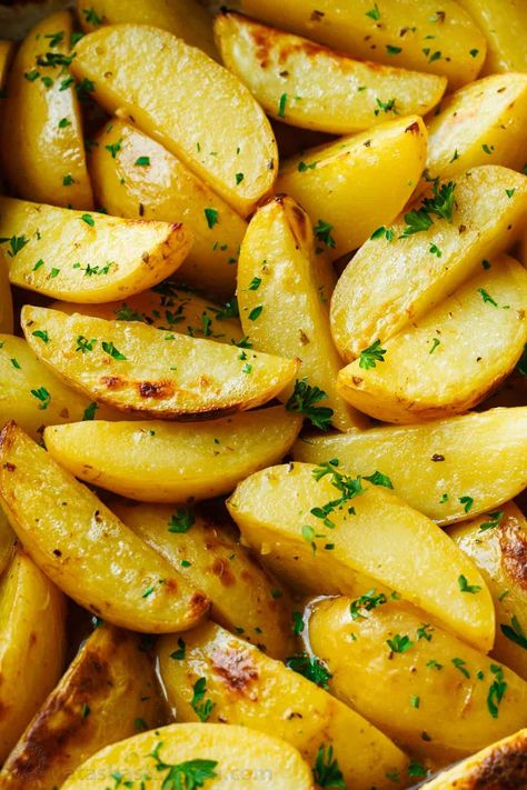 These crispy, golden Greek Lemon Potatoes with a hint of tangy lemon, will transport you right to the Mediterranean- a perfect dinner side dish. Greek Potatoes Air Fryer, Greek Lemon Potatoes Authentic, Greek Potatoes Recipe, Potatoes Dishes, Greek Style Potatoes, Greek Roasted Potatoes, Natashas Kitchen, Lemon Roasted Potatoes, Greek Lemon Potatoes