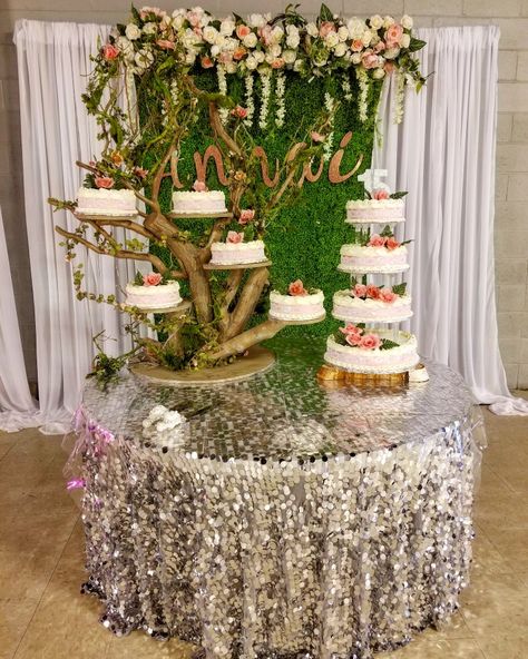 Beautiful cake tree, with backdrop for quinceanera  garden theme Rustic Theme Quinceanera Ideas, Enchanted Forest Quinceanera Cake Ideas, Enchanted Tree Centerpieces, Quinceanera Cakes Enchanted Forest, Enchanted Forest Quinceanera Theme Cake, Neverland Quinceanera Theme, Enchanted Garden Theme Cake, Enchanted Forest Themed Cake, Quince Enchanted Forest Theme Cake