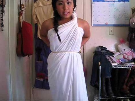 don't want to go out and buy a costume for halloween? go ahead and use an old bedsheet or fabric big enough to wrap around yourself. quick, fast, easy, and cute! hope you enjoy :)    greek goddess tutorial with sewing: http://www.youtube.com/watch?v=mwH_IIrG50s    greek goddess hair tutorial: http://www.youtube.com/watch?v=nB4zrUd-SnA    blog:  http://... How To Tie A Toga, How To Make A Toga, Toga Fancy Dress, Toga Costume Diy, Toga Party Costume, Diy Toga, Greek Goddess Costume Diy, Goddess Costume Diy, Greece Costume