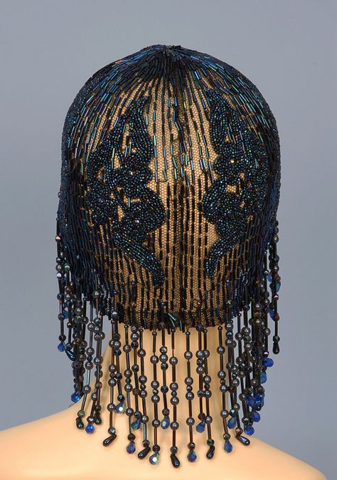 BEADED and SEQUINNED FLAPPER CAP with FRINGE, 1920's. Black net skull cap decorated in midnight blue carnival beads in a floral and bugle bead design, having a fringe of globe, faceted and bugle beads lengthening toward the back.   Back Detail Beaded Headpiece, Roaring 20, 1920's Fashion, Hat Display, Flapper Girl, Fashion Beads, Hair Adornments, Flapper Style, Millinery Hats