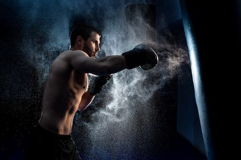 Male boxer boxing in punching bag | Premium Photo #Freepik #photo #fighter #kick-boxing #boxer #boxing Low Key Photo, Dk Photography, Boxer Training, Thai Boxer, American Boxer, Boxing Techniques, Boxing Punching Bag, Male Boxers, Boxing Coach