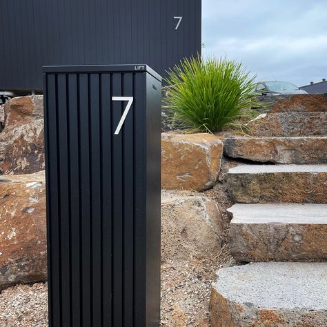 ⭐️ ⭐️ ⭐️ ⭐️ ⭐️ “We love it because: -Simple installation -Our mail doesn’t go missing And … It matches our house!” - Bel P | Happy @milkcanoutdoor Customer Pictured here is our Noosa letterbox in black, paired with a 120mm stainless steel number 7. Find your perfect letterbox online at milkcan.com.au Parcel Mailbox, Letter Box Design, Entrance Design, Fence Gate, Outdoor Products, Front Entrances, Number 7, Letter Box, House Entrance