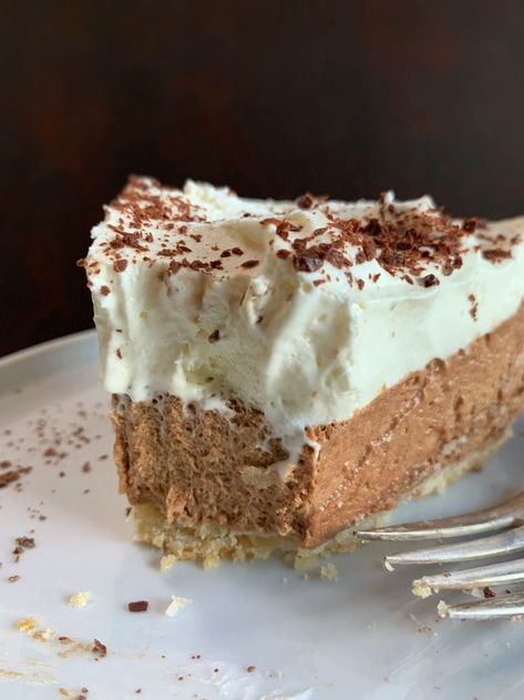 A slice of chocolate chiffon pie with freshly whipped cream and chocolate shavings on top on a white dessert plate. My Country Table, Chiffon Pie, Chocolate Pie Recipes, Holiday Baking Recipes, Country Table, Holiday Recipes Christmas, Chocolate Pies, Dessert Lover, Delicious Pies