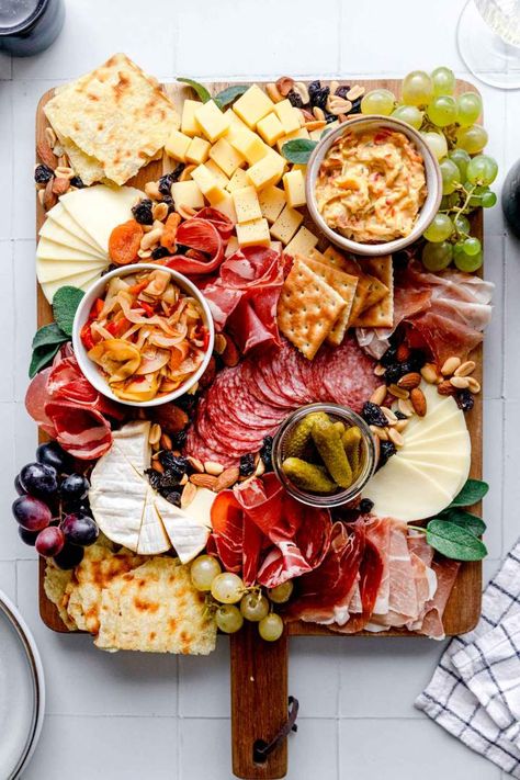 Simple Charcuterie Board is our go-to recipe for the best snack or appetizer. This show-stopping treat is perfect for feeding the crowds for celebrations. Food Platters Presentation, Holiday Charcuterie Board, Holiday Charcuterie, Packaged Snacks, Charcuterie Platter, Party Food Platters, Charcuterie And Cheese Board, Charcuterie Recipes, Cheese Platters