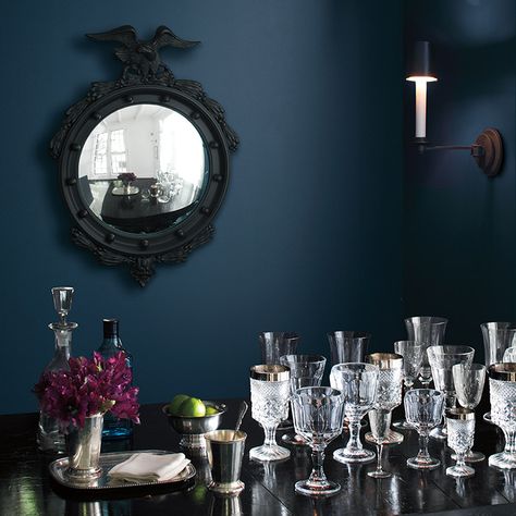 Table with a variety of glasses against a deep blue wall. Vintage Paint Colors, Navy Blue Paint Colors, Color Trends 2017, Navy Blue Paint, Revere Pewter, Blue Paint Colors, Benjamin Moore Colors, Simple Interior, Interior Paint Colors