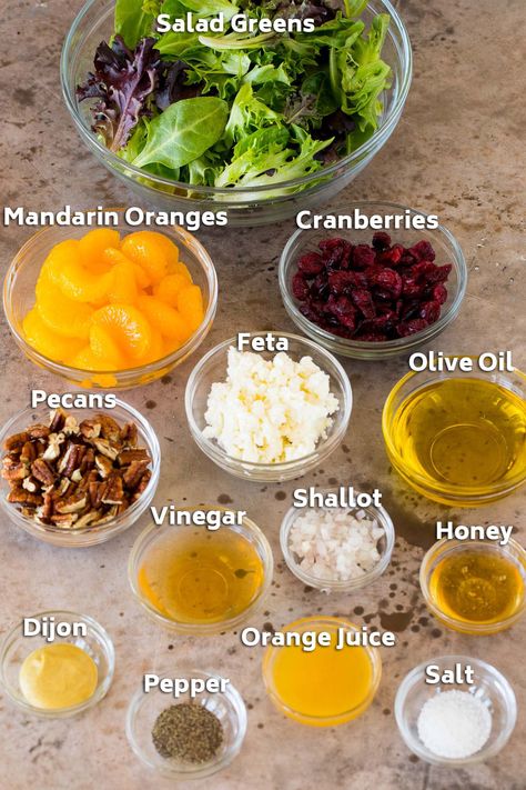 This mandarin orange salad is mixed greens with juicy orange slices, dried cranberries and candied pecans, all tossed in a homemade dressing. A quick and easy salad that's a fresh and colorful complement to chicken and seafood dishes. Blood Orange Salad Dressing, Salad With Orange Slices, Salads With Mandarin Oranges, Betr Diet, Spinach Mandarin Orange Salad, Mandarin Salad Recipe, Beet And Orange Salad, Salad With Oranges, Mandarine Recipes