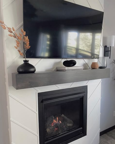 Fireplace Decor With Tv Modern, Dark Gray Mantle, Mantel Decorating Ideas Under Tv, Chimney Decor With Tv, Minimal Mantle Decor With Tv, Decorating A Fireplace Mantle With A Tv, Modern Mantle Ideas, Mantel Under Tv Decor, Under Tv Mantle Decor