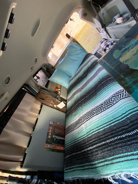 Photograph of the bed I built in my Dodge Grand Caravan in preparation for minivan Vanlife Dodge Caravan Camper, Minivan Conversion, Rv Vans, Bed And Storage, Minivan Camper, Minivan Camping, Solo Camping, Car Camper, Dodge Grand Caravan