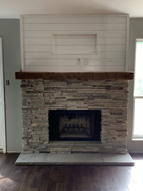 We updated our fireplace surround, removed old brick and installed new stacked stone, mantle, hearth, shiplap and electric for TV. Shiplap Fireplace With Stone Surround, Fireplace Stone Floor, Stone Fireplace And Mantle Ideas, Shiplap Wall With Stone Fireplace, Fireplace With Stacked Stone, Gas Fireplace Stone Surround, Fireplace Stacked Stone Ideas, Shiplap And Brick Wall, Flat Hearth Fireplace