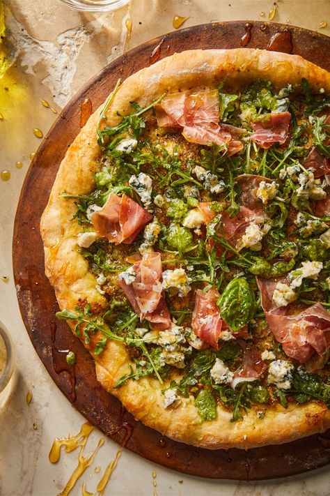 Pesto Prosciutto Pizza is a dreamy homemade pizza made with fragrant basil pesto, garlic, fresh greens, savory prosciutto, crumbled blue cheese and our Italian Pizza Dough Kit. Prosciutto Pizza Recipes, Cast Iron Pizza Recipe, Gourmet Pizza Recipes, Pizza With Pesto, Three Cheese Pizza, Perfect Homemade Pizza, Pesto Pizza Recipe, Basil Pizza, Pizza Oven Recipes