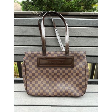 Louis Vuitton Parioli Damier Canvas & Leather Pm Shoulder Tote Bag Brown Os Brand: Louis Vuitton Department: Womens Size: Os Color: Brown Style: Tote Shoulder Bag Closure: Magnetic Snap Pattern: Signature Check Care: Leather Clean Condition: Pre-Owned Made In: France Features: - Damier Coated Canvas With Leather Trim - Dual Flat Leather Shoulder Straps - Interior Red Alkantra Lining - Interior Slip Pockets - Comfortably Carried In Hand Or On Shoulder - Offer Great Capacity - Structured Our Products Are 100% Genuine. In All Cases We Stand By The Authenticity Of Every Product Sold. Our Clothing, Handbags, Shoes May Have A Black Or Red Line Strikethrough Label. If Strikethrough Is Present