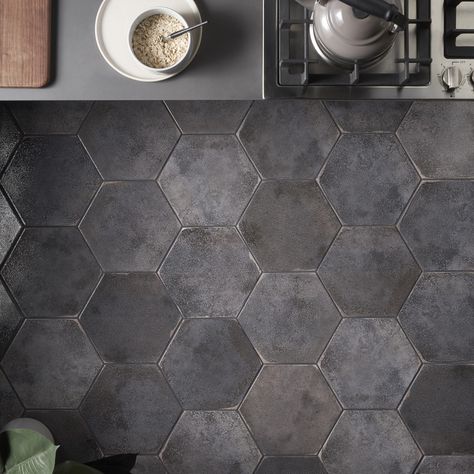 Kalay Antracite 9" Hexagon Polished Porcelain Tile, Gray, Backsplash, Wall and Floor. About The Tile: The Kalay Antracite 9" Hexagon Polished Porcelain tile features a neutral charcoal gray shade with a polished textured finish and worn edges, creating a soft rustic look with contemporary sensibility. The use of chameleon ink creates subtle and reflective color variations while the 20 different faces reinforce an artisanal look of this versatile hexagon format. Modern rustic glazed porcelain til Gray Hexagon Tile, Hexagon Tile Bathroom Floor, Hexagon Tile Bathroom, Black Hexagon Tile, Artmore Tile, Black Tile Bathrooms, Gray Backsplash, Hexagon Floor, Hexagon Tile Floor