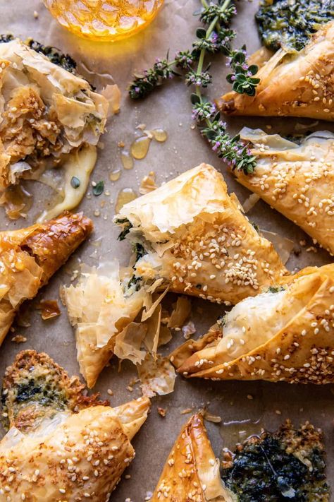 Spinach and Brie Triangles: baked brie triangles with sweet honey and a dust of sea salt...such an easy appetizer that everyone always loves! Brie Phyllo, Phyllo Dough Recipes, Roasted Olives, Spring Appetizers, Savory Pastries, Half Baked Harvest Recipes, Food Bites, Brunch Items, Whipped Feta