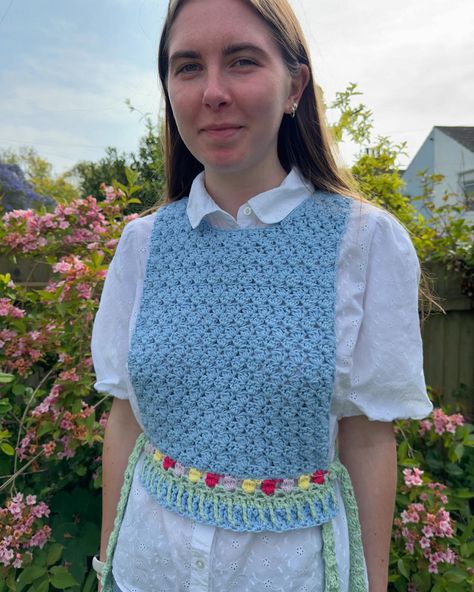 Just finished my wrapped in tulip vest pattern test for @femmescrochet 🌷Such a lovely pattern and super easy to do as well🌿I love how it ties up at the sides🌸It reminds me of the flower fields from howls moving castle🪻 #crochetinspiration #crochet #patterntest #hippie #crochetlover  #70s #smallbusiness #handmadewithlove #sunflower #crochetsunflower #crochetvest #crochetwaistcoat #summer #summermakes #spring #crochetspring #pattern #howlsmovingcastle Crochet Waistcoat, Vest Pattern Free, Crochet Tie, Howls Moving, Crochet Sunflower, Crochet Lovers, Vest Pattern, Crochet Vest, Howls Moving Castle