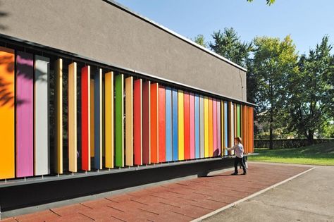 Colorful interactive design enables children to play with & change their kindergarten's exterior wall. Kindergarten Kekec by Jure Kotnik Architecture Rainbow Interior, Interaktives Design, School Building Design, Prefab Buildings, Kindergarten Design, Kindergarten Lesson Plans, Kindergarten Lessons, School Building, Building Facade