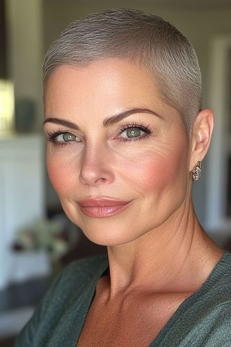 Polished Platinum Buzz Cut for Women Over 50 Grey Buzzcut Women, Women Buzzcut Style, Blonde Buzzcut Woman, Buzzcut Women Aesthetic, Buzz Cut Women Round Face, Feminine Buzz Cut, Female Buzz Cut, Buzzcut Women, Pixie Buzz Cut