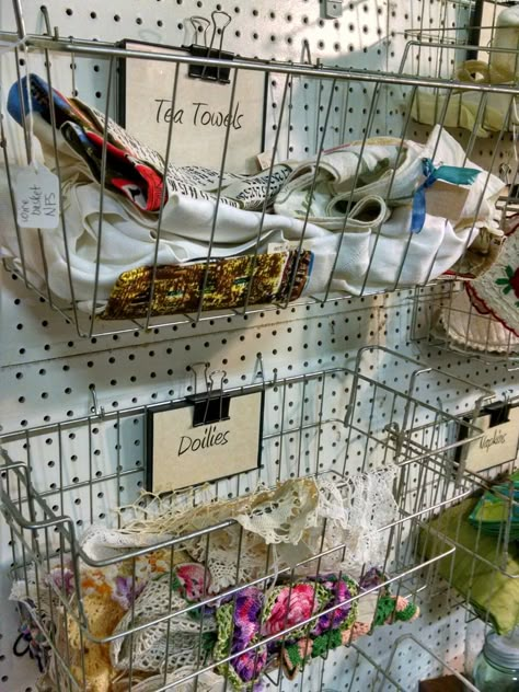 Vintage Freezer baskets and binder clips on pegboard are great display storage for antique or craft booth. Pegboard Shop Display, Decorate A Booth Display Ideas, Antique Booth Pegboard Display Ideas, Antique Fair Booth Display, Flea Market Set Up Display, Pegboard Store Display, Antique Shop Booth Display Ideas, Pegboard Booth Display, Pegboard Antique Booth