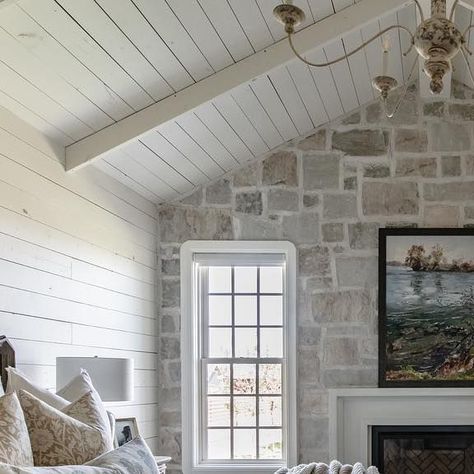 Christie Lewis Interiors on Instagram: "One of my favorite rooms in the Benjamin Farmhouse is hands down the master bedroom. This space was an addition onto the existing structure of the home. My clients 100% trusted me on adding stone to the wall & I am so glad they did! I love the way it paired with the rafter ceiling, shiplap, & distressed chandelier make you feel like you’ve stepped into a room that has been there for hundreds of years 🤎🤍 @eric_budge_custom_homes @rebekahwestoverphotograph Distressed Chandelier, Rafter Ceiling, Brick And Shiplap, Ceiling Shiplap, Bead Board Walls, Brick Interior Wall, Brick Interior, Limestone Wall, Stone Wall