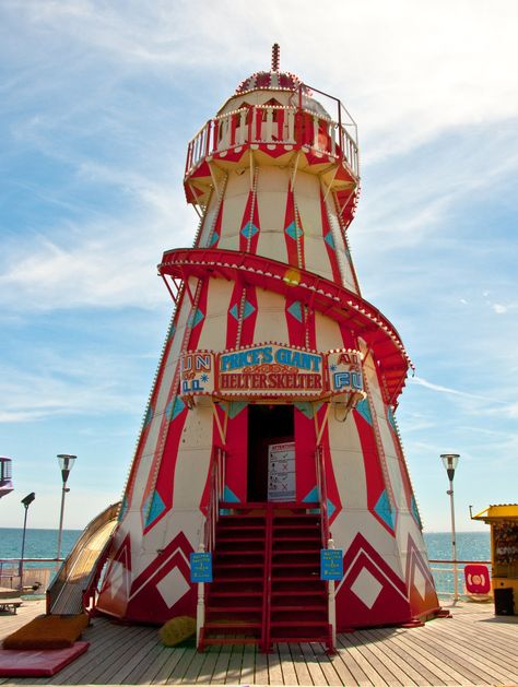 A vintage "Price's Giant Helter Skelter" ride. Climb the interior stairs to the top, then slide down the helical exterior slide while sitting on a burlap sack. Coming Soon Shop, Vintage Seaside, Fair Rides, Carnival Art, Helter Skelter, Seaside Theme, British Seaside, Carnival Rides, Petite Clothing