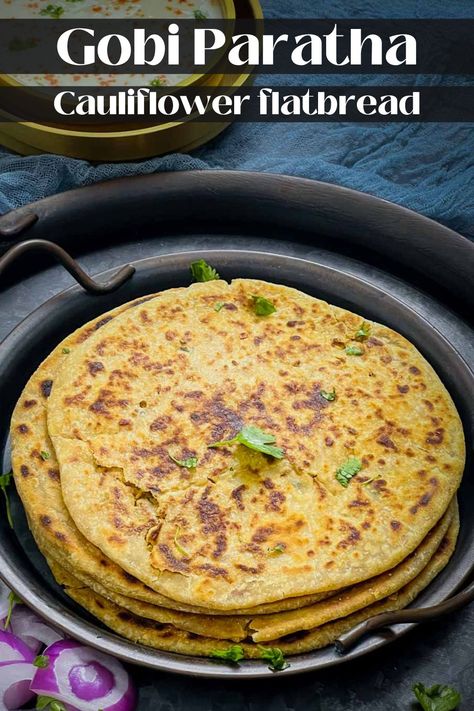 Gobi paratha is a popular Indian flatbread stuffed with spiced cauliflower (gobi). This easy-to-follow recipe combines the goodness of whole wheat flour (atta) and a savory cauliflower filling, creating a delicious and satisfying meal. Cauliflower Gobi, Gobi Paratha, Stuffed Flatbread, Indian Comfort Food, Indian Breads, Indian Vegan, Indian Flatbread, Indian Cookbook, Spiced Cauliflower