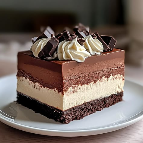 Indulge in the rich, creamy layers of this Triple Chocolate Mousse Cake. Perfect for chocolate lovers and special occasions. Dark Chocolate Mousse Cake, Triple Chocolate Mousse, Triple Chocolate Mousse Cake, Chocolate Mousse Cake Recipe, Mousse Cake Recipe, Dark Chocolate Mousse, Mousse Cakes, Things To Bake, Cakes Frosting