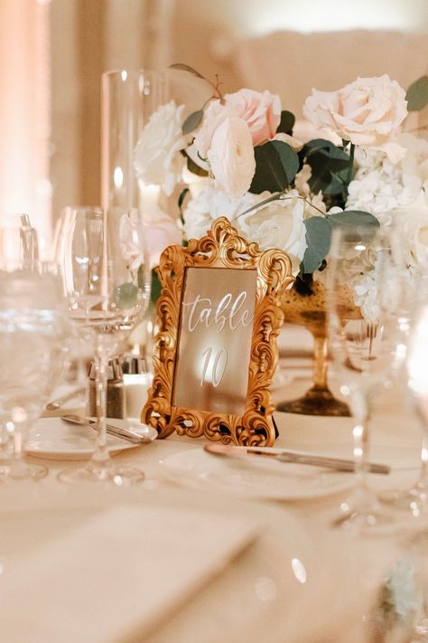 The antique gold mirror table numbers and candles on the reception tables gave me all the Bridgerton wedding vibes. I loved all the romantic touches at this fairytale spring wedding in Boston. If you're looking for New England's best wedding photographer to capture all of your wedding details, contact Lena Mirisola Photography! Wedding Table Numbers Mirror, Wedding Mirror Table, Elegant Vintage Wedding Ideas, Table Number Frames, Antique Gold Wedding Decor, Gold Wedding Table Numbers, Mirror Table Numbers Wedding, Vintage Table Numbers Wedding, Vintage Gold Wedding Decor