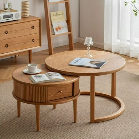 This size combination coffee table is made of FAS grade cherry woodwhich is firm and sturdyThe wood texture is clear and beautifulOne high and one short are inclusive and orderlyIt can be adjusted at will according to the size of the spaceThe small coffee table is thoughtfully designed with multiple storage spaces and sliding doorsVery delicatecan store some small items in daily lifemake the table tidierand prevent dust from fallingEvery push and pull is like opening a little treasure at home. Round Coffee Table Sets, Nordic Style Living Room, Push And Pull, Round Wood Coffee Table, Table Cafe, Nesting Coffee Tables, White Living, Small Coffee Table, Apartment Inspiration