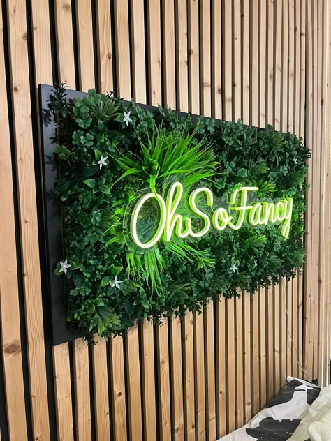 Have your own custom wording or logo backed by lush and beautiful tropical foliage🌴 All our signs are dimmable LED💡and presented in a wooden picture frame. Hooks on the back make this ready to hang in your bedroom, beauty space, living room, kitchen or anywhere you want to be OhSoFancy!😍 Mains operated and suitable for indoor use only. These signs are hand made in Cambridgeshire with great quality materials and allot of love.💖 🤔What's Next? Please ensure you provide your email address and a Grass Wall With Led Sign, Neon Outdoor Sign, Grass Wall Bar Ideas, Green Wall With Led Sign, Green Accent Wall Salon, Moss Wall With Logo, Logo On Wall Ideas, Faux Living Wall Indoor, Green Wall With Neon Sign