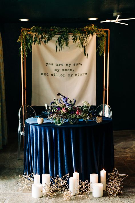 Dark and Moody Celestial Wedding Inspiration via Rocky Mountain Bride Constellation Wedding Decor, Celestial Wedding Sweetheart Table, Celestial Woodland Wedding, Moon Decor Wedding, Celestial Wedding Aisle, Celestial Wedding Signage, Celestial Wedding Backdrop, Starry Night Wedding Flowers, Start Night Wedding