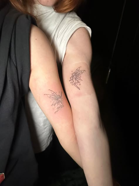 Fairy Tattoo For Best Friends, Fairy Couple Tattoo, Fairies Holding Hands Tattoo, Matching Fairy Wing Tattoos, Fairy Reaching Up Tattoo, Fairy Tattoo Unique, Fairy Friends Tattoo, Fairy And Sun Tattoo, Fairy And Mermaid Matching Tattoo