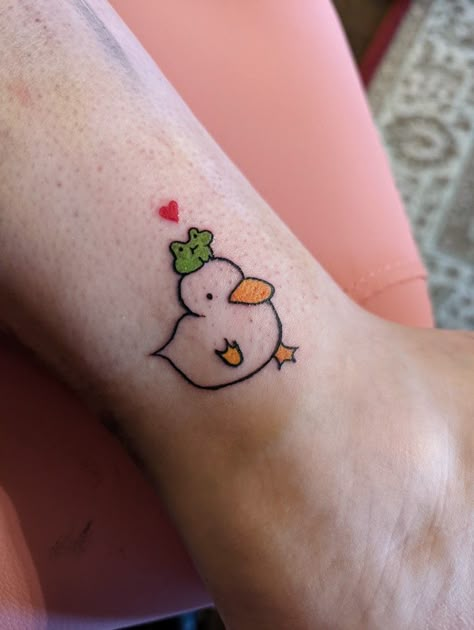 A small tattoo for my cousin. It's a little duck with a frog on his head ! Frog Wine Glass Tattoo, Duck Tattoos Small Funny, Weird But Cute Tattoos, Small Cute Frog Tattoo, Super Cute Tattoos, Lil Frog Tattoo, Frog And Duck Tattoo, Frog Tattoos Cute, Duck Tattoos Cute