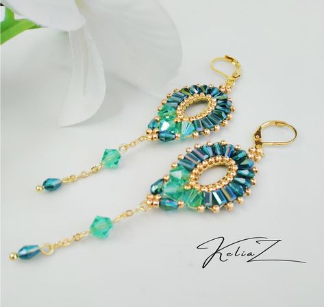 Excited to share the latest addition to my #etsy shop: Caribbean Sea long earrings. Long evening earrings. Swarovski crystals.Sparkling modern chain earrings https://etsy.me/46qHQOf #girls #oval #earlobe #artnouveau #earwire #gold #no #green #zircon Unique Beaded Earrings With Dangling Beads For Beach, Handmade Oval Beaded Earrings, Luxury Women's Drop Beaded Earrings, Elegant Oval Beaded Earrings, Luxury Beaded Drop Earrings For Statement Piece, Evening Earrings, Chain Earring, Wrist Jewelry, Beaded Bracelets Tutorial