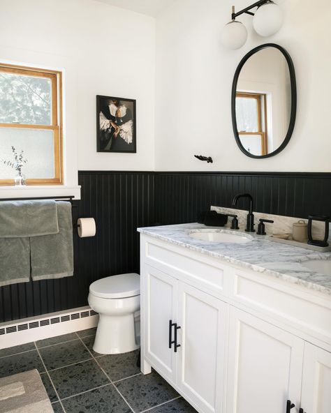 Since I’m on the bathroom train, let’s talk about one of the bathrooms in our Catskills mountain house that I designed. When we first walked the house in ‘21, we were told that the one bathroom in the house was “tastefully updated”. I use air quotes because you never know what people consider tasteful. Suffice to say, tasteful it was not. Yes, installation was new, but they installed floor to ceiling large format tiles from the 80’s. Everything was screaming, “why did you install me” and I kn... Black Panelling Bathroom, Black Trim Bathroom, Black Bead Board, Soaker Tub Shower Combo, Floor To Ceiling Tile, Black Bathrooms, Large Format Tiles, Mini Bathroom, Air Quotes