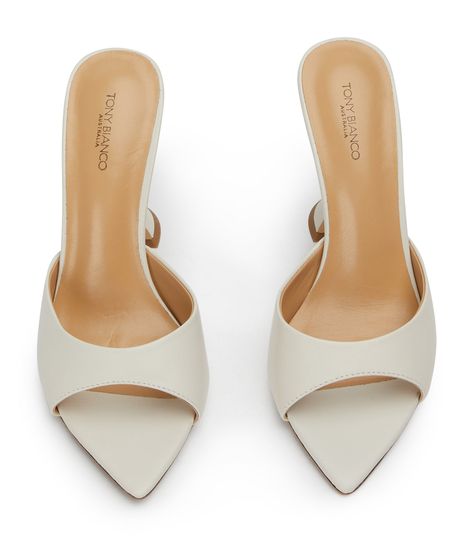 Pointed perfection, the Marcel mules are designed with a sleek and paired back shape and feature an open pointed toe-shape, a low cut rounded vamp and a chic hourglass shaped heel. With a quality luxe leather upper, lining and cushioned sole this style is not to be missed. -Material: Leather Upper & Lining -Sole: Man-Made -Fit: True to size -Toe-shape: Pointed -Features: Hourglass shaped heel -Heel: 10.5cm Bridal Shoes Closed Toe, Wedding Shoes Thick Heel, White Heel Outfit, Cool Heels Unique, Comfortable Kitten Heels, Heels With Dress, Wedding Block Heels, Going Out Shoes, Office Heels