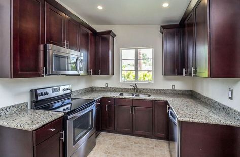 U shaped kitchen with dark shaker cabinets and granite counters #smallkitchen #interiordesign #kitchen Dark Cabinet Kitchens, Kitchens With Dark Cabinets, Kitchen With Dark Cabinets, Cabinets Design Ideas, Small White Kitchens, Redecorating Ideas, Cabinets Design, Shaped Kitchen, Small Kitchen Ideas