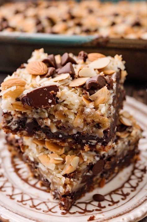 Indulge in decadent Almond Joy Magic Cookie Bars packed with gooey chocolate, crunchy almonds, and sweet coconut. Perfect treat for any dessert lover! #Dessert #Baking #Chocolate #AlmondJoy #SweetTreats Homemade Almond Joy Bars, Almond Joy Cookie Bars, Keto Almond Joy Cookies, Coconut Magic Bars, Almond Joy Bars Recipe, Magic Cookie Bars Recipe, Almond Joy Brownies, Almond Joy Cake, Magic Cookie Bar Recipe