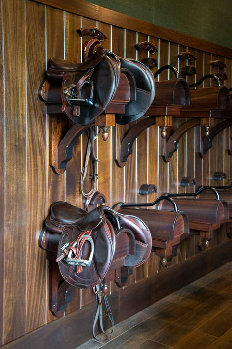 Your saddle is probably the most important piece of equipment in your tack room. A simple rack will do, but why not take it up a notch? Make sure the saddle rack is in the most functional place for the room, and be creative with the design! This is a piece that should fit the personality of the rider and the horse. English Tack Room, Tack Room Ideas, Luxury Horse Barns, Tack Room Organization, Equestrian Tack, Saddle Racks, Tack Rooms, Horse Barn Ideas Stables, Saddle Rack