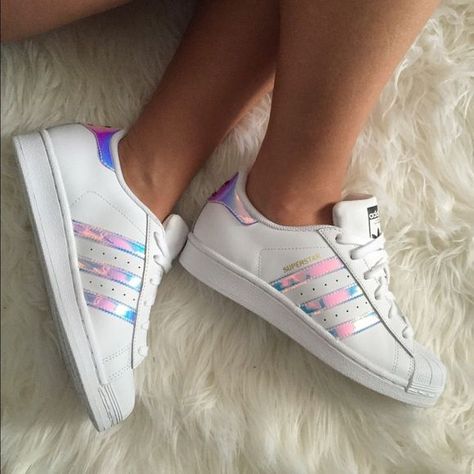 Pinterest: dopethemesz ; iridescent dreams; Adidas Superstar Holographic/Iridescent Sold out EVERYWHERE! I stalked Amazon to get these  finally did! I dont wear them nearly as much as I though that I would, so Im thinking of selling. Accepting offers Adidas All Star Shoes, Adidas Superstar Holographic, Rich Closet, Adidas Super Star, Adidas All Star, Unicorn Shoes, Holographic Iridescent, Adidas Super, All Star Shoes