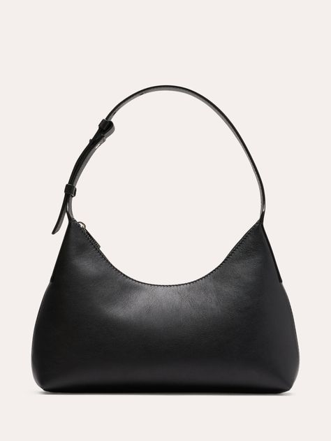 An ode to the 90s minimalist trend, this shoulder bag is cut in a silhouette that hovers somewhere between half-moon and triangle.  Here, we added an adjustable strap and zip closure, keeping the styling sleek to showcase this beautiful leather.  Zip-top closure.  Adjustable shoulder strap.  Height: 7. 7" Width: 11" Depth: 2. 4" Small Black Shoulder Bag, Ford Aesthetic, Elegant Chic Outfits, Euro Winter, Look Expensive On A Budget, Drippy Fits, How To Look Expensive, Budget Outfits, Look Expensive