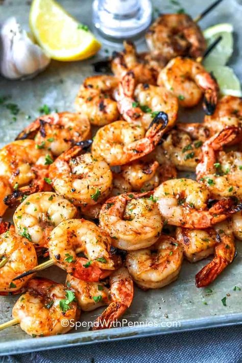 Garlic Grilled Shrimp is a perfect summer staple on the grill! Just a simple soak in this tangy marinade for a delicious shrimp kabob or tucked into a zesty shrimp taco! This will become one of your ‘go-to recipes’ that make summertime livin’ so easy! #spendwithpennies #grilledshrimp #grillingrecipe #grilledrecipes #shrimpmarinade #shrimpskewers #shrimptacos #shrimpkabobs #garlicshrimp #summerrecipe Shrimp Kabobs On The Grill Skewers, Shrimp Kabobs On The Grill Marinade, Shrimp Kabobs On The Grill, Garlic Shrimp Marinade For Grill, Shrimp On Skewers On Grill, Grilled Shrimp Skewers Marinade, Best Grilled Shrimp Skewers, Grilled Shrimp Recipes On Stove, Summer Shrimp Recipes