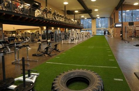 Set your facility apart by installing one of our many options of Artificial Grass Turf. Our turf is perfect for speed and agility training, floor and group exercise, fitness boot camps, sports fields and arenas, gyms, athletic facilities, Crossfit, sled pulling and batting cages. Not only is our turf tough, it will last for many … Fitness Design Gym, Sports Training Facility, Warehouse Gym, Club Fitness, Football Academy, Fitness Studio Training, Dream Gym, Gym Design Interior, Gym Facilities