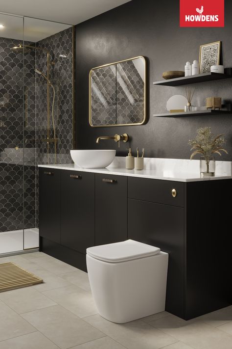 Transform your bathroom into a luxurious space with Howdens Hockley Super Matt Black Bathroom. This stylish bathroom features a sleek and elegant black vanity that complements the gold quartz countertops and brass bathroom fixtures perfectly. The vinyl flooring adds warmth and texture to the space, while the modern design creates a relaxed and inviting atmosphere. With its timeless appeal and practical functionality, this bathroom is sure to impress. Howdens Bathrooms, Gold Quartz Countertops, Howdens Hockley Super Matt, Howdens Hockley, Matt Black Bathroom, Brass Bathroom Fixtures, Mdf Doors, Fitted Bathroom, Black Vanity