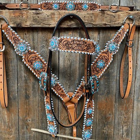 "Browband, one ear, wither strap and breastcollar is floral tooled whipstitch style. They are decorated with antique silver Turquoise/AB crystal conchos/buckles. Browband, one ear measure 44\" bit to bit at the longest setting. The breastcollar is regular horse size. Lifetime guarantee on all crystals. Buy Together or Separate BROWBAND ONLY - $413.00 ONE EAR ONLY - $364.00 BREASTCOLLAR ONLY - $339.00 WITHERSTRAP ONLY- $114.00 BROWBAND TACK SET -$752.00 ONE EAR TACK SET- $703.00 BROWBAND WITHERST Western Horse Tack Turquoise, Western Riding Tack, Western Tack Sets, Barrel Racing Tack Sets, Barrel Racing Tack Rodeo, Bling Horse Tack, Horse Tack Accessories, Western Horse Saddles, Wither Strap