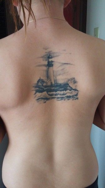 A realism piece done by @ingutswetrust. A reminder that there is always light in the darkness and a light to guide us home. #Lighthouse #LighthouseTattoo #Tattoo #BackTattoo Lighthouse Tattoo, Epic Tattoo, Light In The Darkness, Spine Tattoos, In The Darkness, The Darkness, Back Tattoo, Ink Art, Tattoos And Piercings