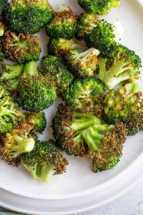 Air fryer broccoli turns crispy and delicious in less than 10 minutes. Cooking broccoli in the air fryer is an easier way of making roasted broccoli. Broccoli In Air Fryer, Air Fryer Roasted Broccoli, Broccoli In The Air Fryer, Roasting Broccoli, Cooking Broccoli, Air Fryer Broccoli, How To Cook Broccoli, Air Fryer Pork Chops, Fried Broccoli