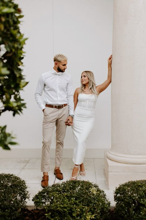 Elegant & classy engagement photos Elegant Fall Engagement Pictures, Champagne Dress Engagement Pictures, Dressy Engagement Outfits, Jumpsuit Engagement Photos, Classic Engagement Photos Outfits, Engagement Party Couple Outfits, White Jumpsuit Engagement Photos, Engagement Photos Glam, Couple Formal Outfits Classy Engagement Pictures