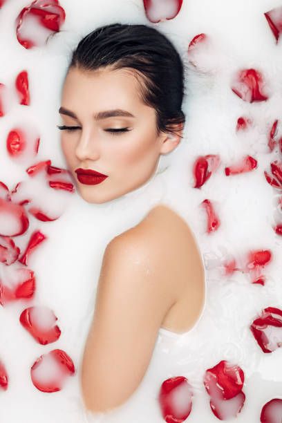 Attractive girl enjoys a bath with milk and roses Milk Photography, Milk Bath Photos, Bathtub Photography, Milk Bath Photography, Bath Photography, Flower Bottle, Creative Photoshoot Ideas, Photographie Portrait Inspiration, Flower Bath