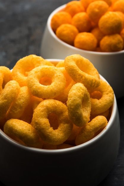 Cheese balls rings, corn puff with crisp... | Premium Photo #Freepik #photo #crisps #indian-snacks #cheese-ball #potato-fries Corn Puffs, Garlic Fried Rice, Textures Art, Potato Curry, Garlic Fries, Cheese Balls, White Bowl, Indian Sweet, Crisp Recipe