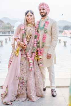 Pink Lehnga Dress Couple, Pastel Pink Wedding Lehenga, Pink Lehenga Bride And Groom, Pink Bridal Lehenga With Groom, Pastel Pink Lehenga Bridal, Bride Lehenga Indian Pink, Sikh Groom Outfit, Pastel Pink Bridal Lehenga, Bride In Pink Lehenga